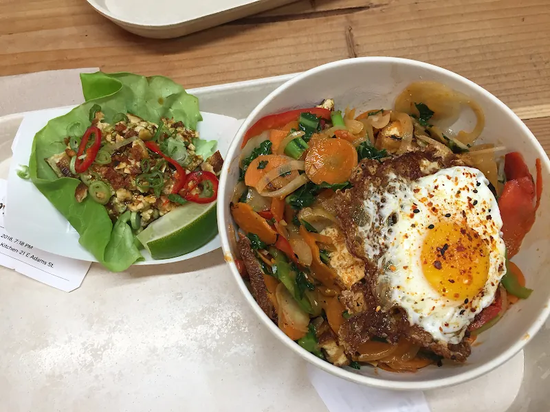 Brightwok Kitchen rice bowl topped with a fried egg