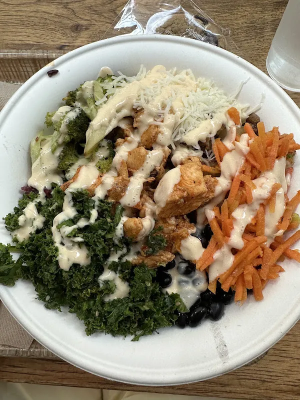 BIBIBOP rice bowl with kale, carrots and chicken